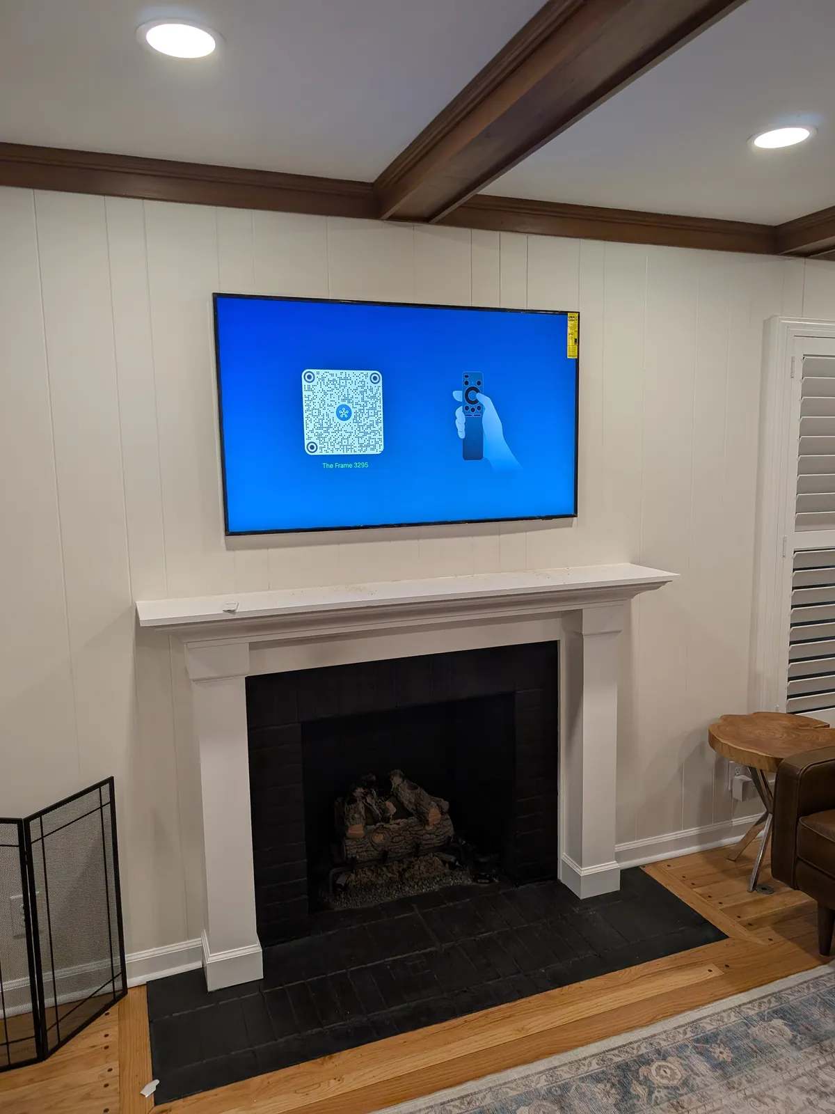 TV mounted above stone fireplace