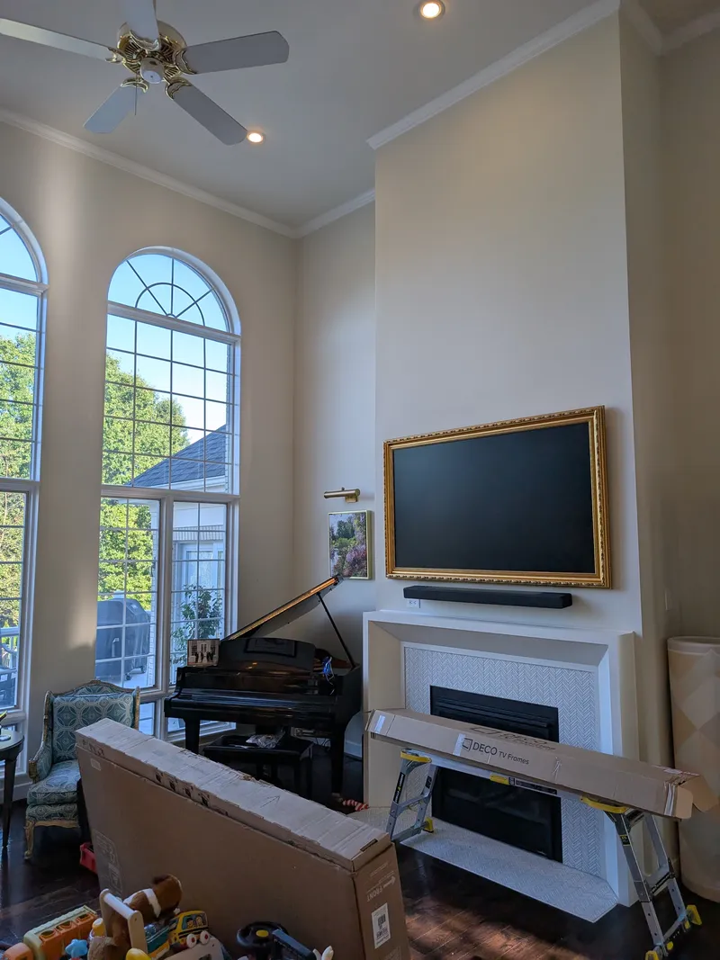 Samsung Frame TV with gold Deco TV frame above fireplace in Prospect KY