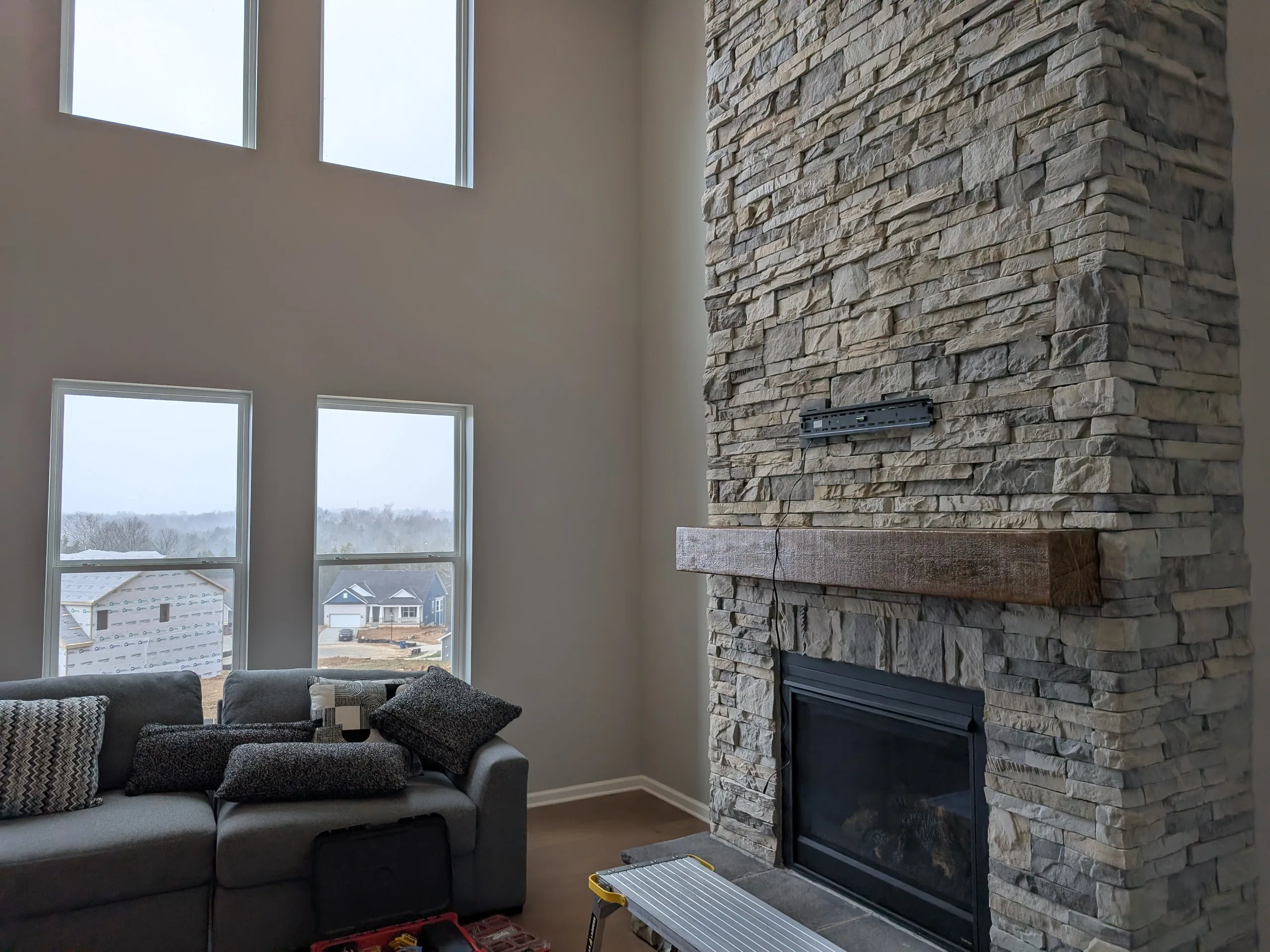 Stone fireplace TV mount bracket installation process Catalpa Farms Louisville KY