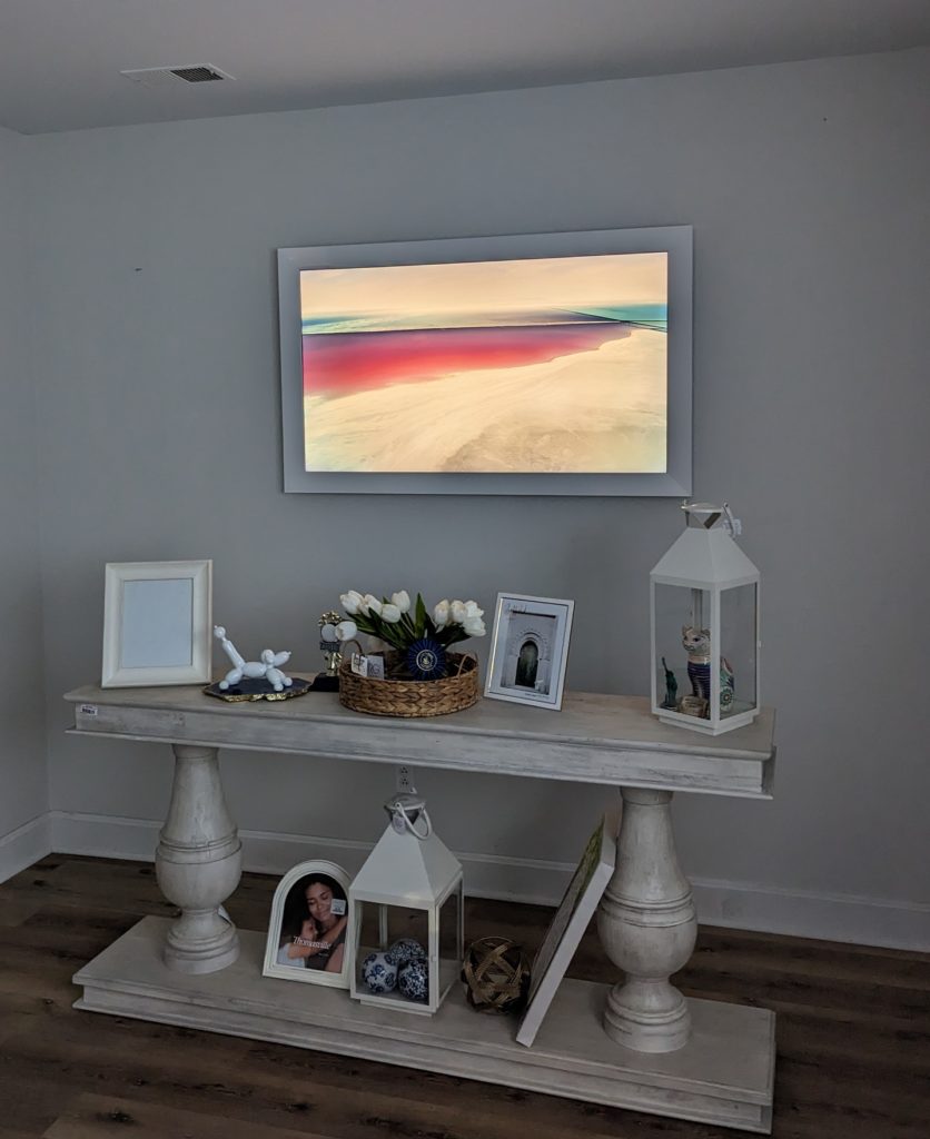 Samsung Frame TV installed by Rock Paper TV with all components concealed in a media enclosure, achieving a clean and stylish look. | TV Mounting Louisville Kentucky